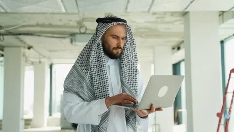 Arab engineer working on laptop in construction site montage Stock Footage 316742159