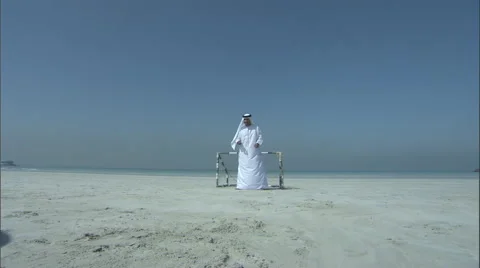 An Arab father and son playing football with an oversized ball. Video stock 46864455