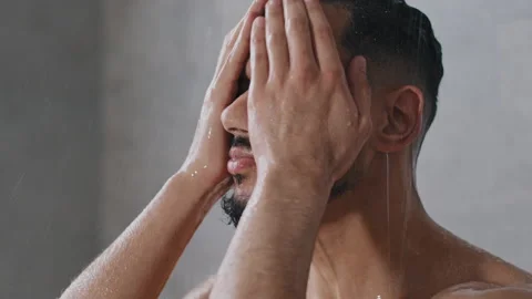 Arab indian man bearded guy naked male washes head with shampoo washing hair Stock Footage 170139192