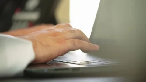 Arab male person using a lap-top keyboard close shot Stock Footage