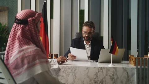 Arab man applying for visa at German embassy and receiving application refusal Stock Footage 327786666