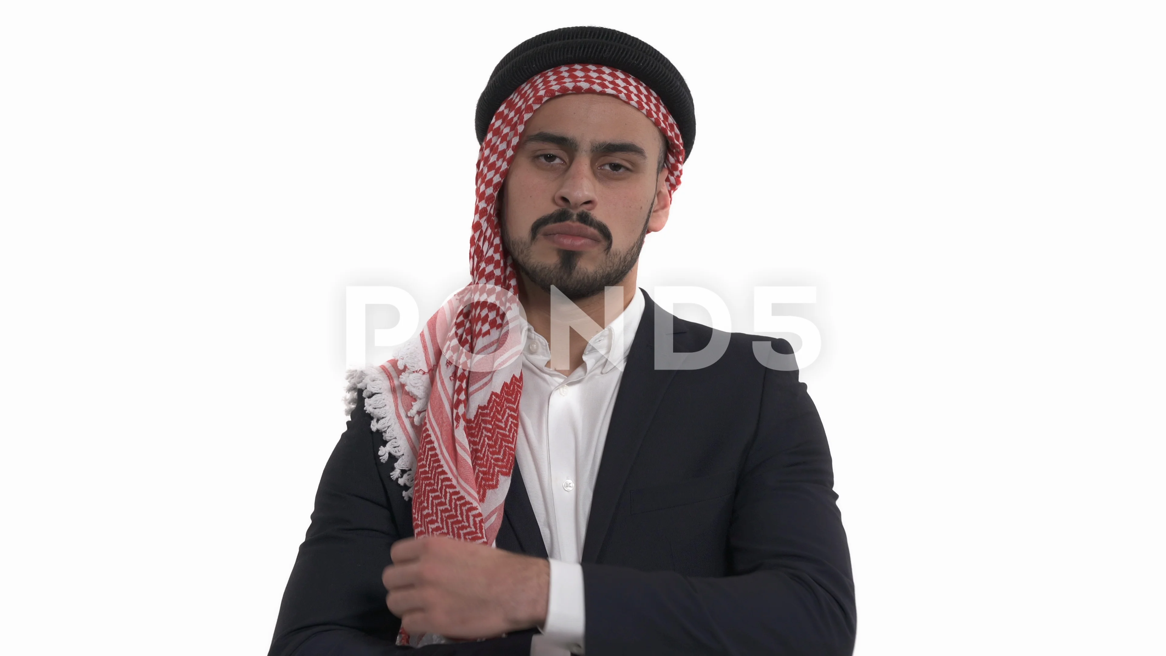 Young man wearing Keffiyeh on head, carrying bullhorn, you…