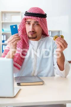 Arab man with bitcoin in cryptocurrency mining concept Stock Photos
