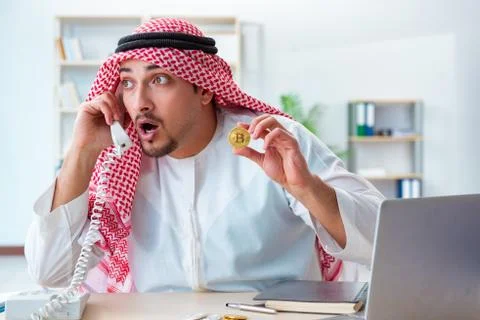 Arab man with bitcoin in cryptocurrency mining concept Stock Photos
