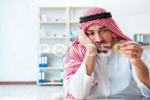 Arab man with bitcoin in cryptocurrency mining concept Stock Photos