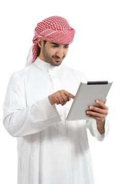 Arab man browsing a digital tablet Stock Photos