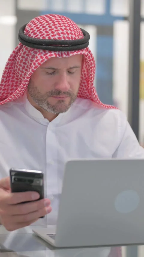 Arab Man Browsing Internet on Smartphone, vertical video Stock-Footage 324777250