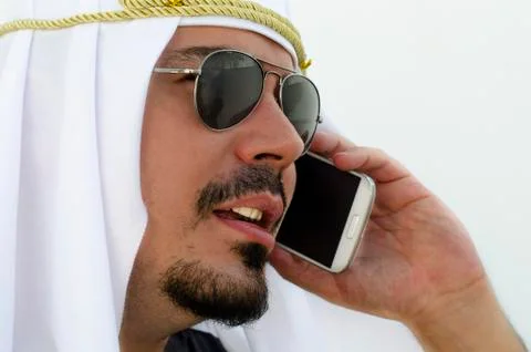 Arab man calling at smartphone Stock Photos