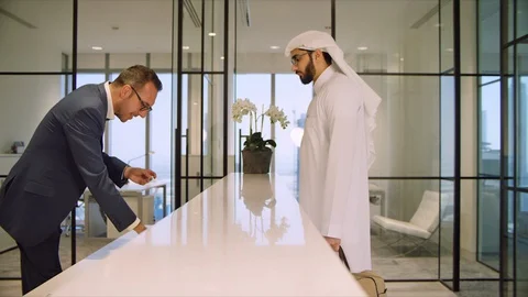 Arab man checking in at hotel. Stock Footage 129421383