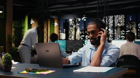 Arab man with disability, telephone call chat, during office work session Stock Footage 334040442