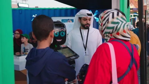 Arab Man Explaining Features And Functions Of A Robot To People. - forward 動画素材 238983102