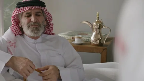 Arab man holding prayer bead talking. Stock Footage 88095823