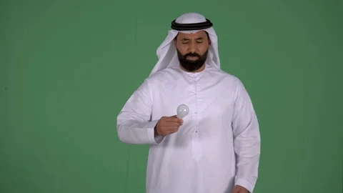 Arab man holding throwing a burnout bulb. Stock Footage 94479634
