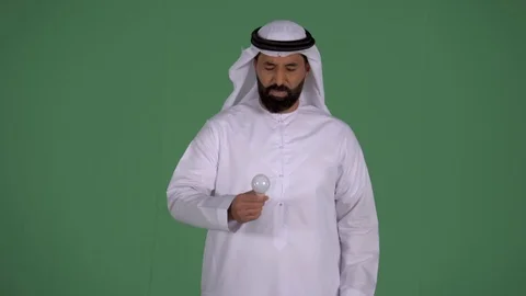 Arab man holding throwing a burnout bulb. Stock Footage 94479665