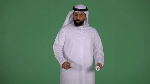 Arab man holding two bulbs. Stock Footage 94479770