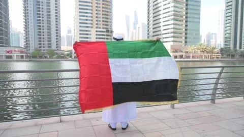 Arab Man holding UAE flag Video stock 142236878