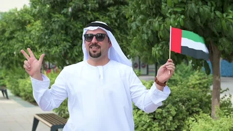 Arab Man holding UAE flag Video stock 142236937