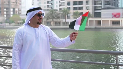 Arab Man holding UAE flag Video stock 142237199