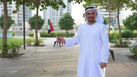 Arab Man holding UAE flag Video stock 142237229