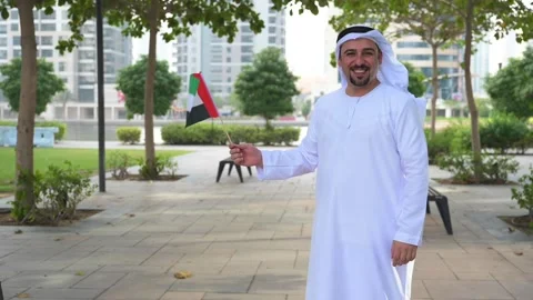 Arab Man holding UAE flags Video stock 142237218