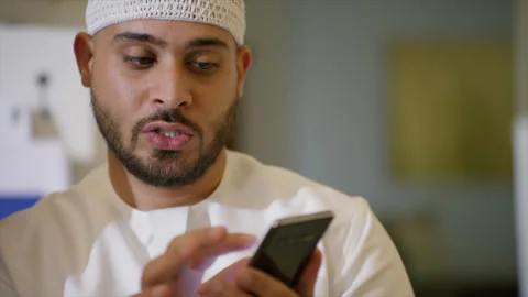 Arab man looking at his mobile. Stock Footage 135915762