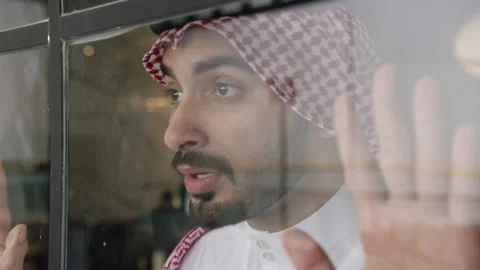 Arab man looking out the window. Stock Footage 152975808