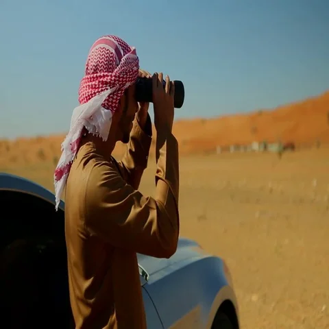 Arab man looking through binoculars. Stock Footage 69405475