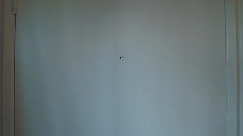 Arab man opens apartment door and looks into unit Stock-Footage 89237254