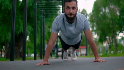 The Arab man performs exercises compressed from the floor Stock Footage 199427405