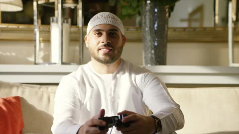 Arab man playing video game. Stock Footage 136062835