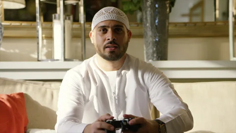 Arab man playing video game. Stock Footage 136063022