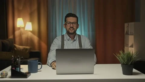 Arab man smiles and waves his hands to camera, conducts conversation with Stock Footage 156463363