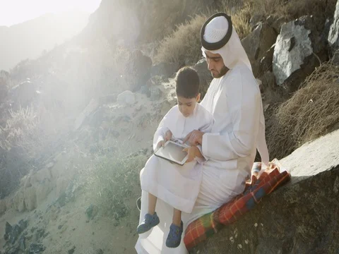 Arab man with son using digital tablet. Stock Footage 69455035