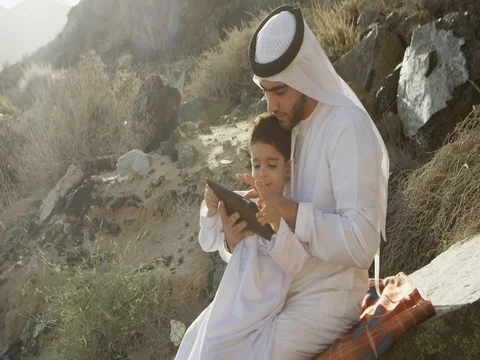 Arab man with son using digital tablet. Stock Footage 69455248