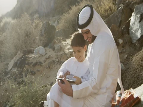 Arab man with son using digital tablet. Stock Footage 69457938