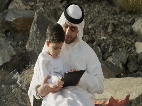 Arab man with son using digital tablet. Stock Footage 69460329