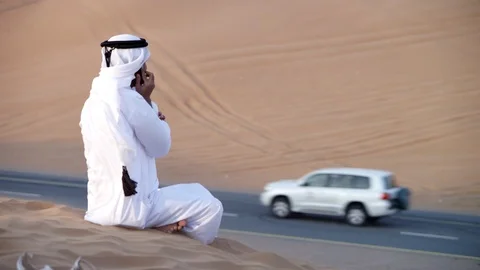 Arab man talking on mobile at desert. Stock Footage 119394118