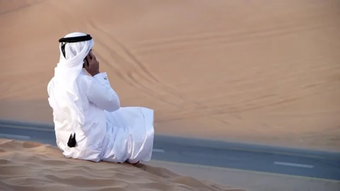 Arab man talking on mobile at desert. Stock Footage 119394292