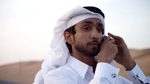 Arab man talking on mobile at desert. Stock Footage 119394372