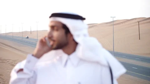 Arab man talking on mobile at desert. Stock Footage 119395052