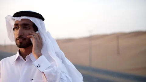 Arab man talking on mobile at desert. Stock Footage 119395115