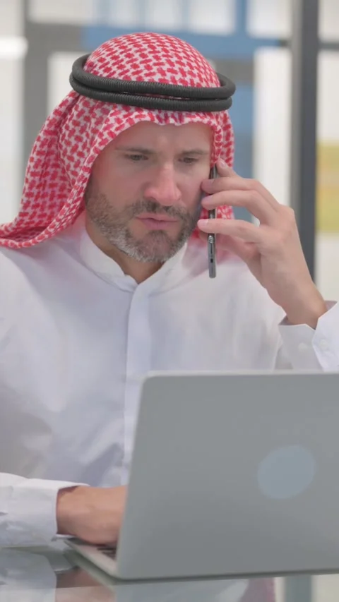Arab Man Talking on phone, Doing Negotiation, vertical video Stock Footage 324777249