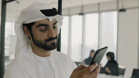 Arab man texting on his mobile. Stock Footage 126310647