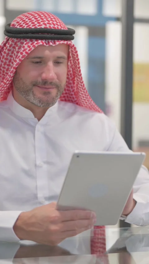 Arab Man using Digital Tablet in Office, vertical video Stock Footage 324777275