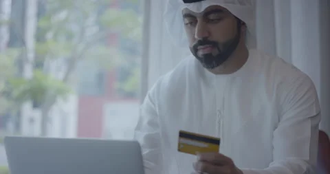 Arab man using his credit card. Video stock 247180652