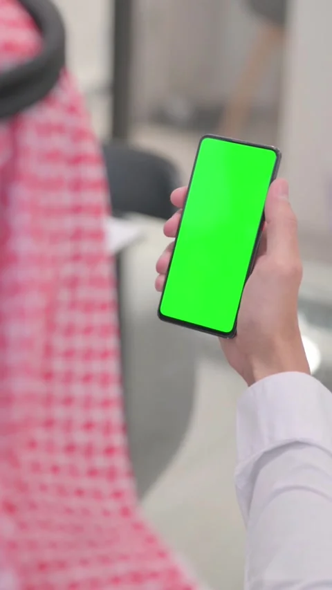 Arab Man Using Phone with Green Screen, vertical video Video stock 324712019