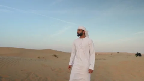 Arab man walking in the desert. Stock Footage 235099342