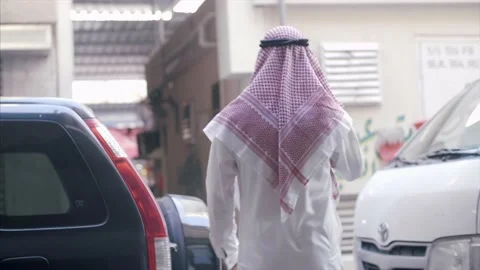 Arab Man walks through the local Souk. Stock Footage 157396518