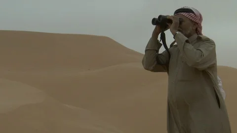 An Arab man watching through his binoculars. Stock Footage 120063238