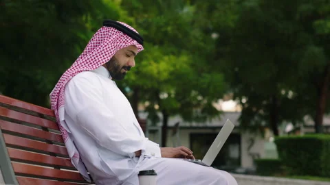 Arab man working on his laptop outdoors. Stock Footage 237167442